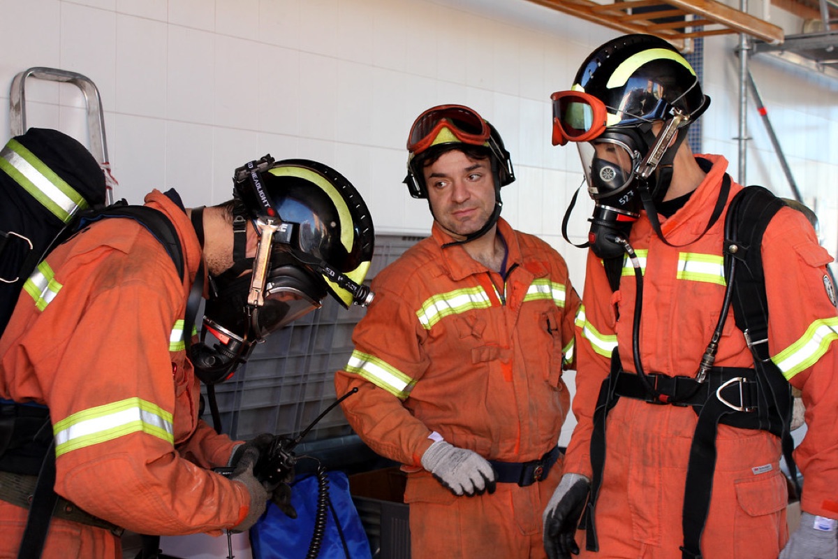 Essential safety gear including protective goggles and heavy-duty work gloves