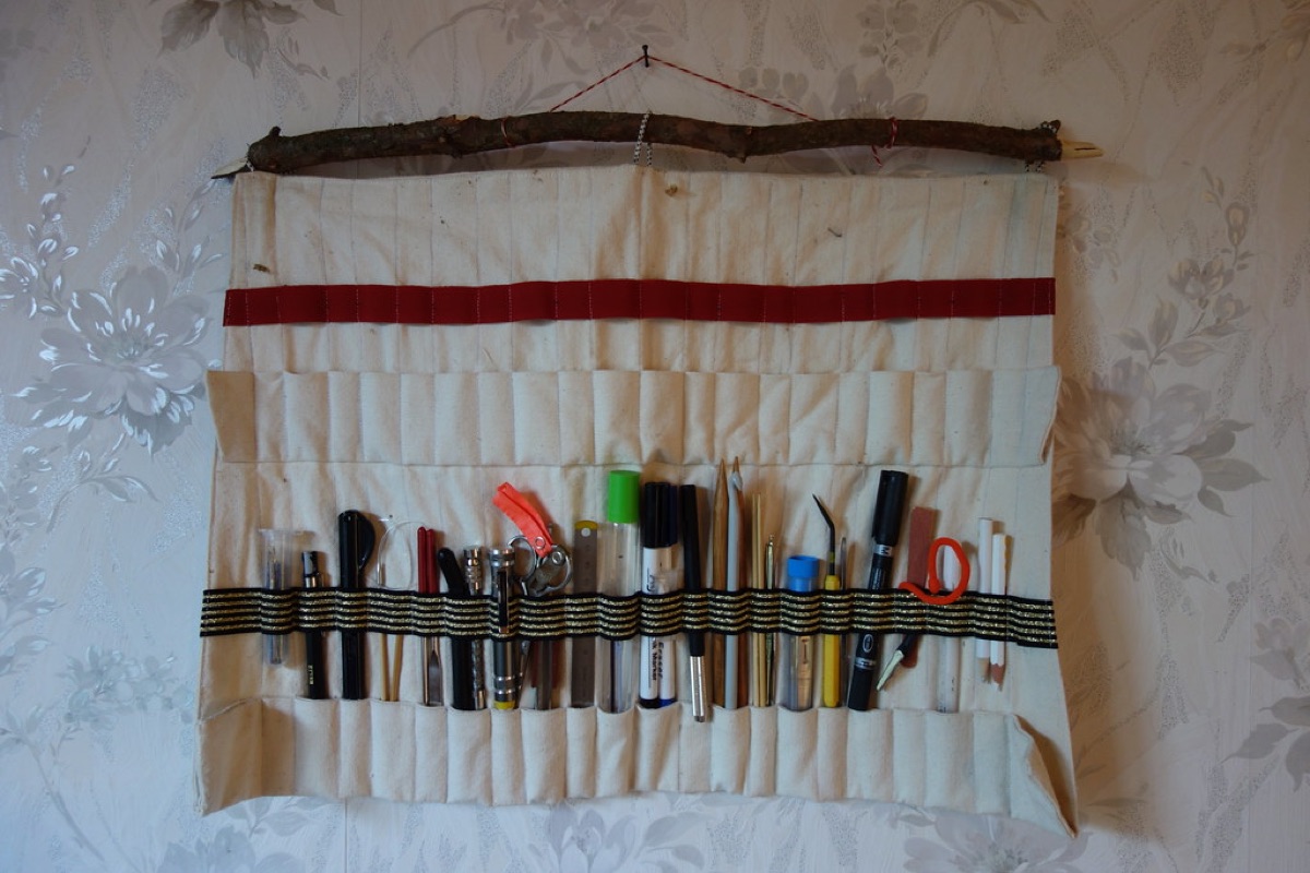 Cluttered workbench with organized tool bins